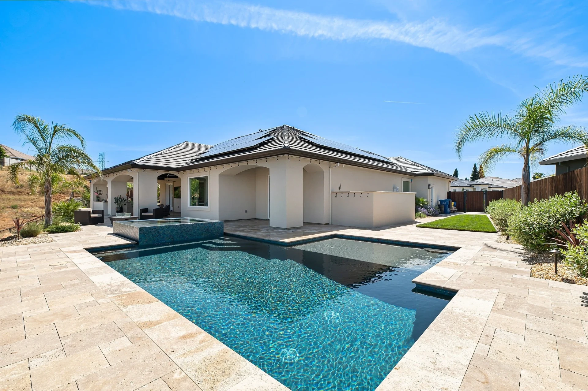Clean backyard swimming pool serviced by Ponchos Pool Services in New Braunfels
